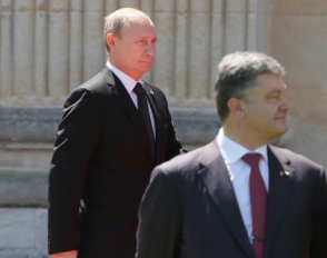 Путин и Порошенко обсудили первоочередные меры для прекращения кровопролития на Украине