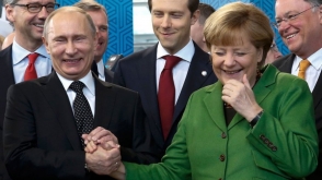 Меркель по-русски спросила у Путина про сибирское пальто